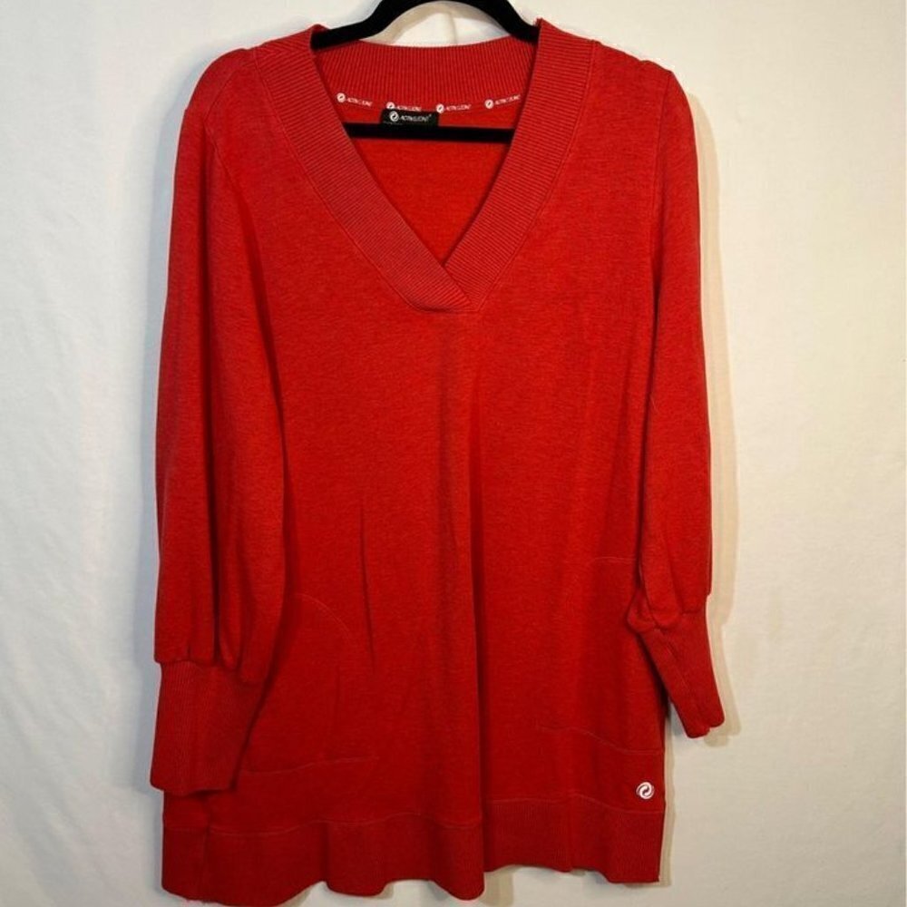 Woman’s tunic (rust colour). Size Large. Extremely soft. Slight balloon sleeve.